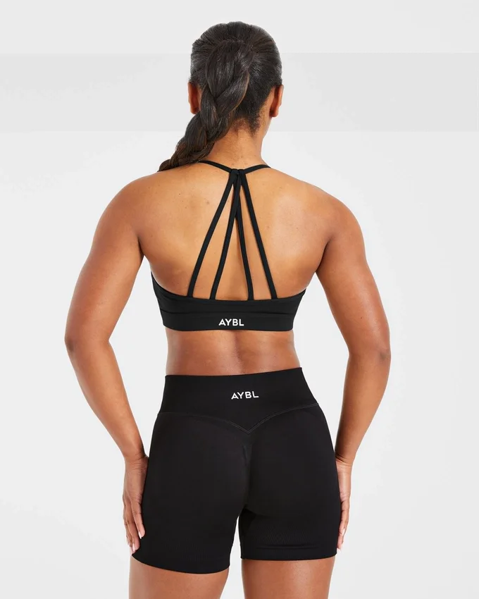 Essential V-ringad sport-BH med band