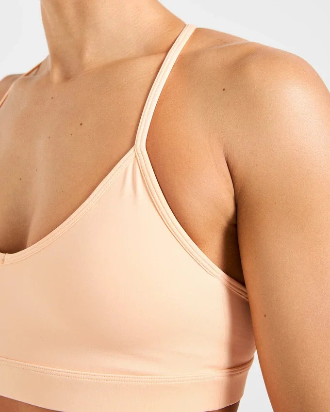 Essential V-ringad sport-BH med band