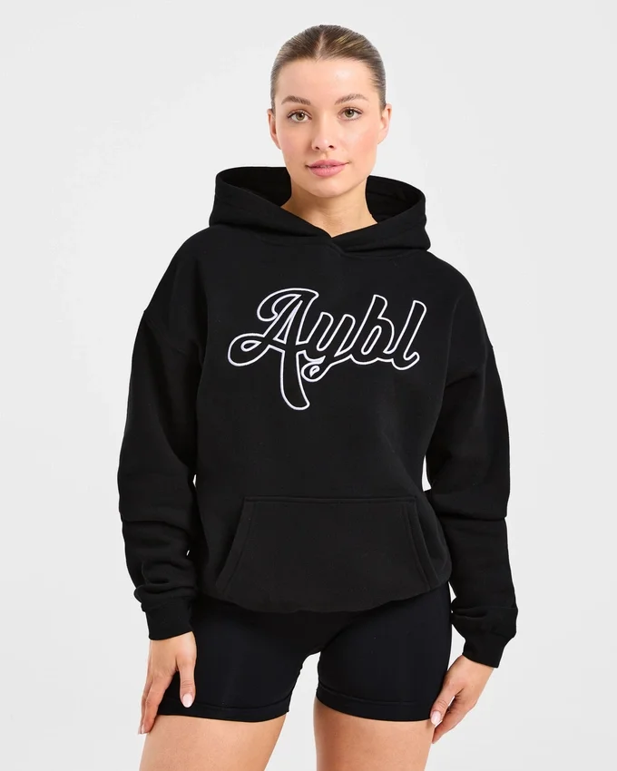 Oversized-hoodie med broderad text