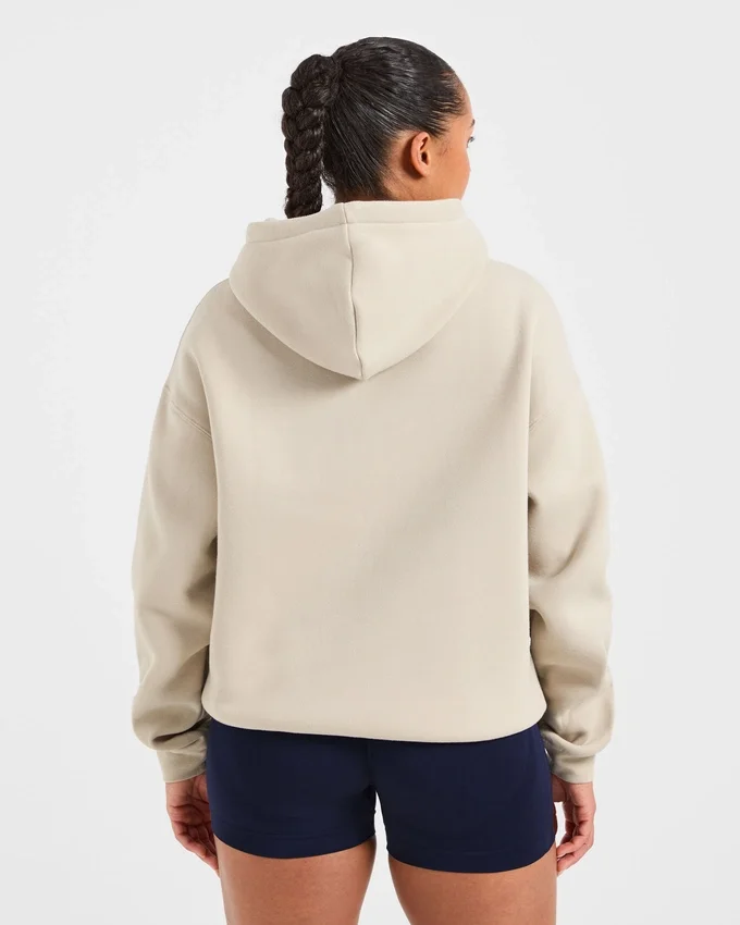 Oversized-hoodie med broderad text
