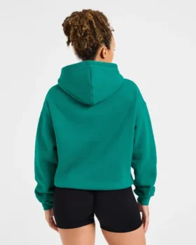 Oversized-hoodie med broderad text
