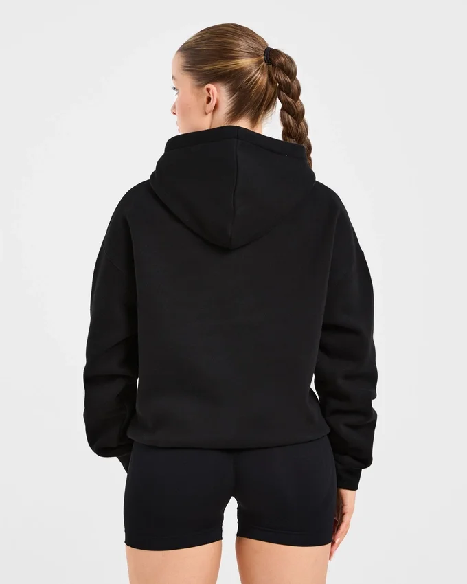Oversized-hoodie med broderad text