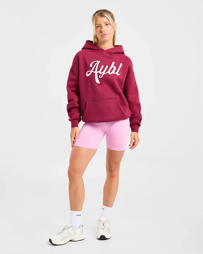 Oversized-hoodie med broderad text