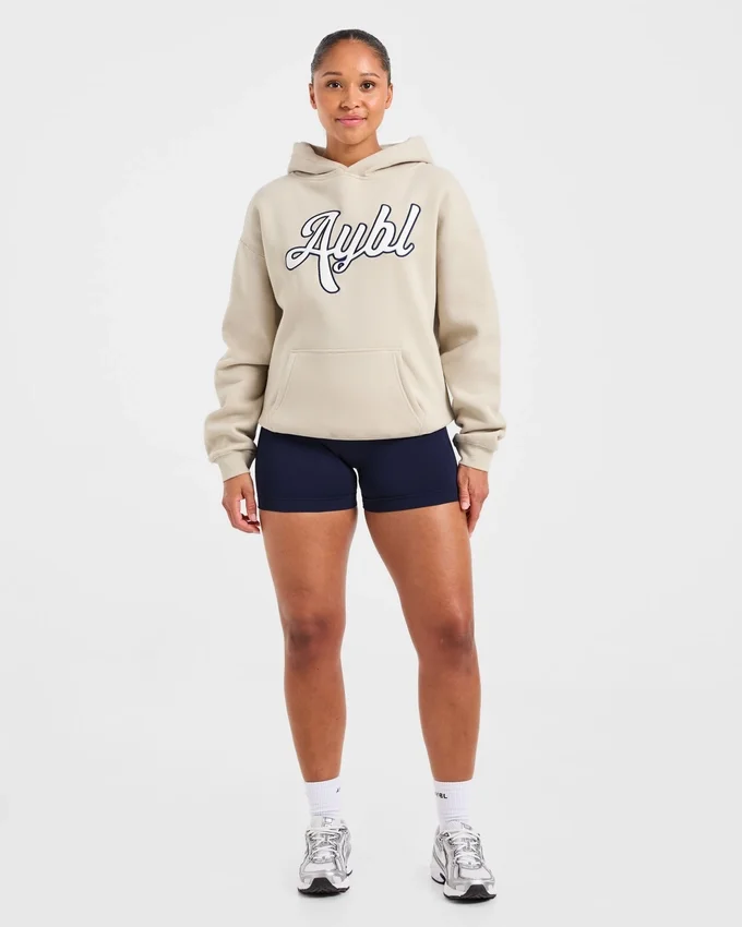 Oversized-hoodie med broderad text