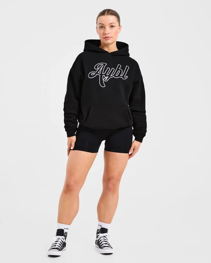 Oversized-hoodie med broderad text