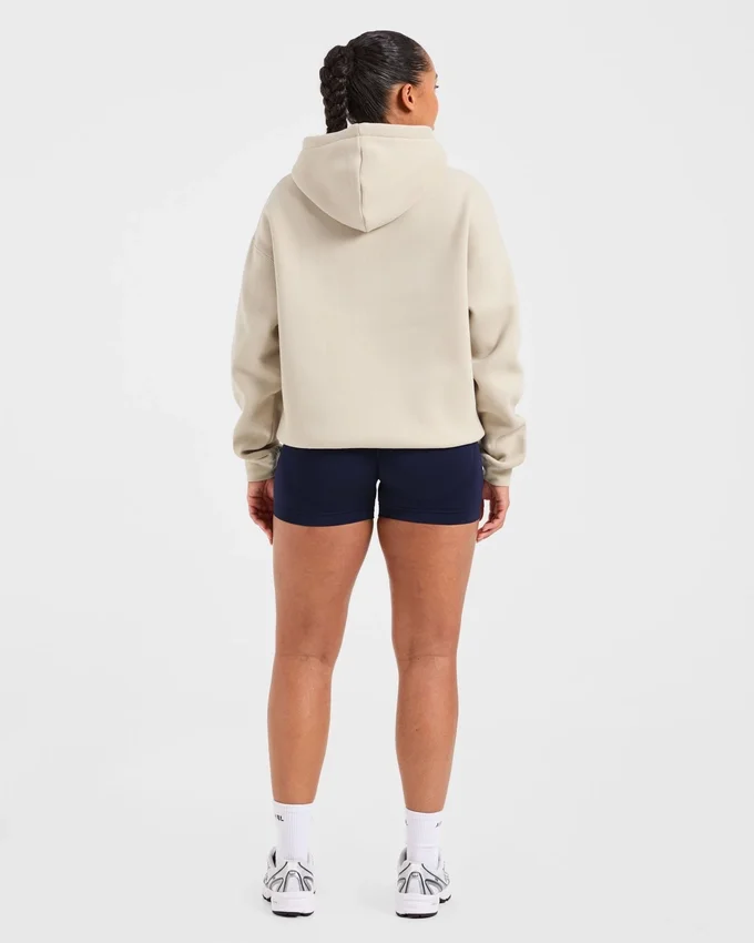 Oversized-hoodie med broderad text