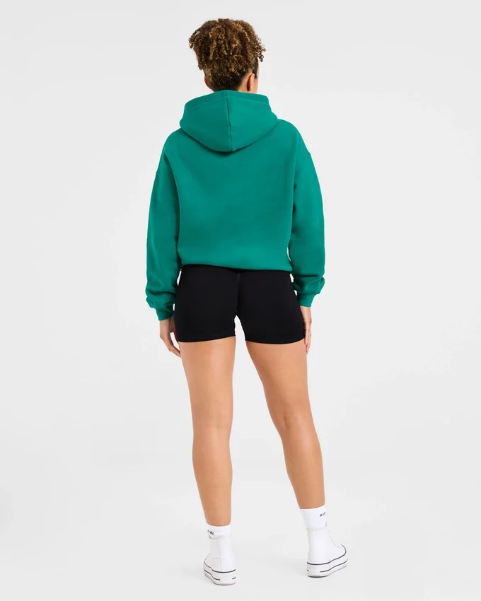 Oversized-hoodie med broderad text