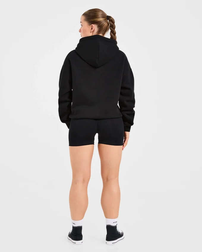 Oversized-hoodie med broderad text