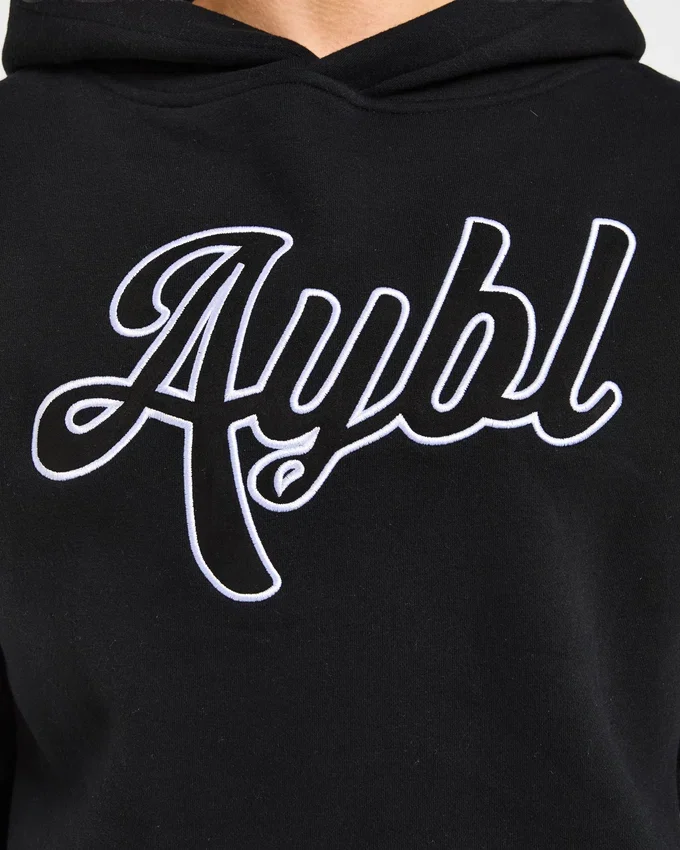 Oversized-hoodie med broderad text