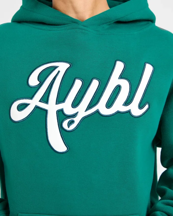 Oversized-hoodie med broderad text