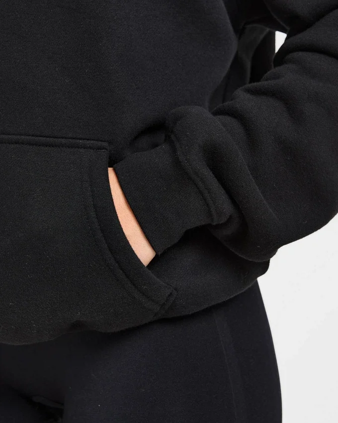 Oversized-hoodie med broderad text