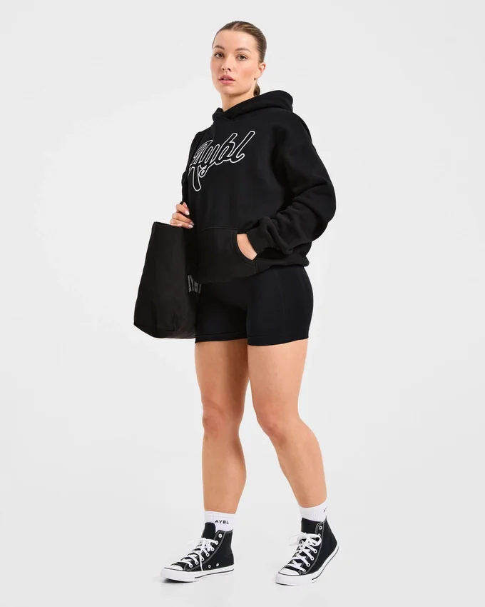 Oversized-hoodie med broderad text