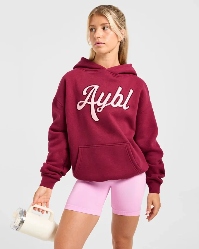 Oversized-hoodie med broderad text