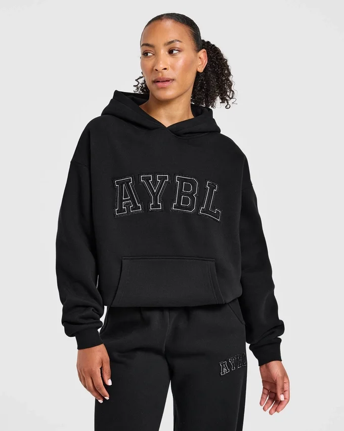Varsity-hoodie med applikation i oversized-passform