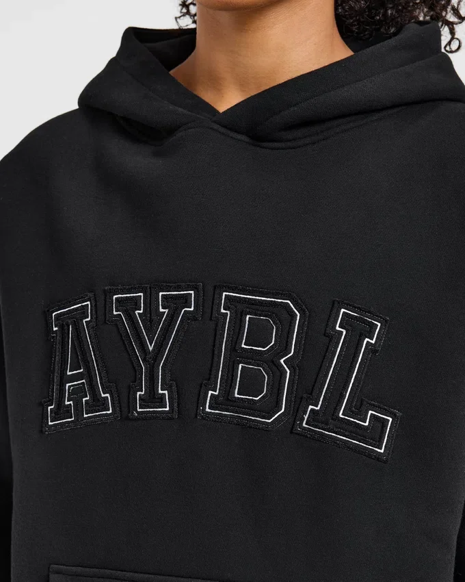 Varsity-hoodie med applikation i oversized-passform