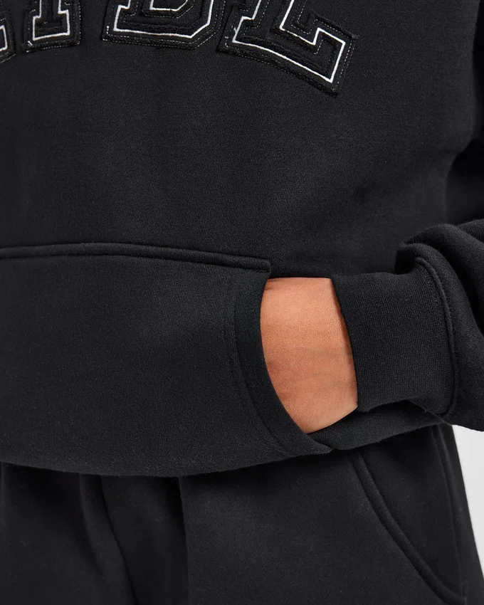 Varsity-hoodie med applikation i oversized-passform