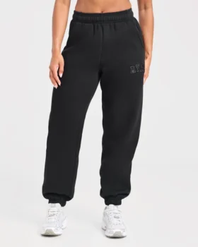 Varsity-mjukisbyxor i oversized-modell med applikation