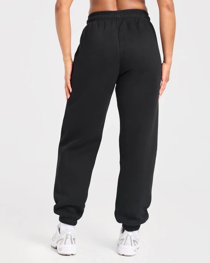 Varsity-mjukisbyxor i oversized-modell med applikation