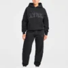Varsity-mjukisbyxor i oversized-modell med applikation