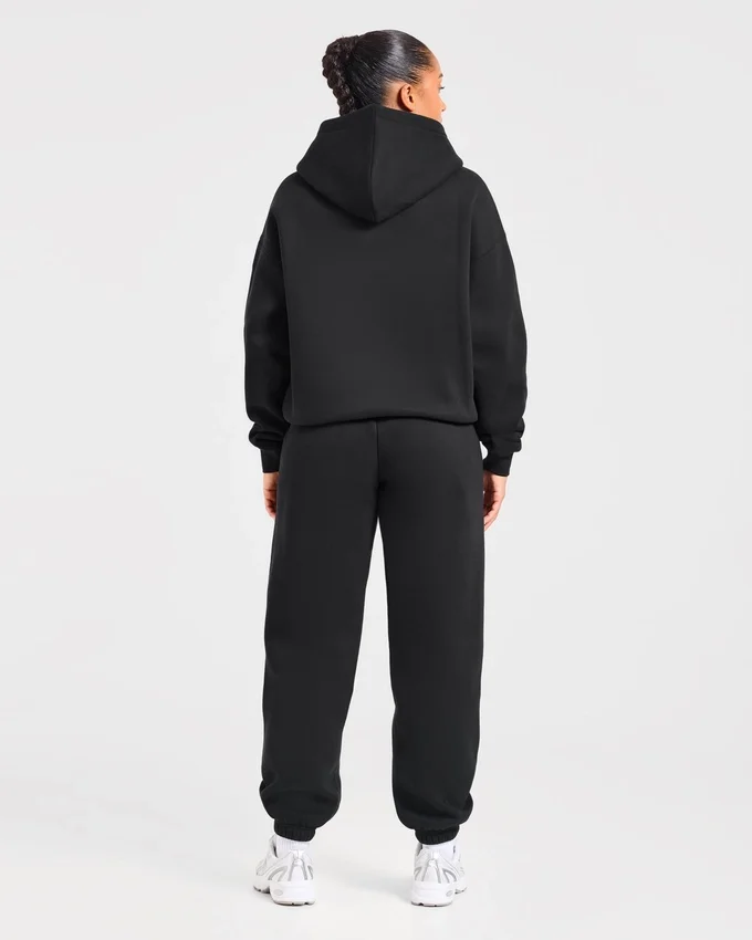 Varsity-mjukisbyxor i oversized-modell med applikation