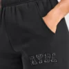 Varsity-mjukisbyxor i oversized-modell med applikation