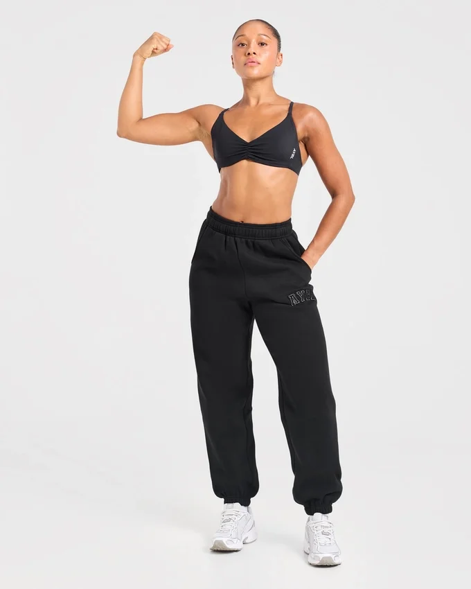 Varsity-mjukisbyxor i oversized-modell med applikation