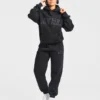 Varsity-mjukisbyxor i oversized-modell med applikation