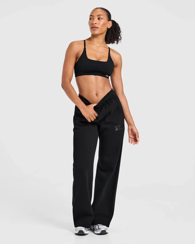 Varsity-mjukisbyxor med applikation och raka ben i oversized-modell